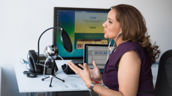 A woman recording a podcast.