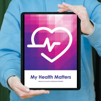 A person holding a tablet with the My Health Matters cover page.