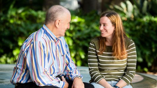 A dad and a daughter with intellectual disability having a conversation.